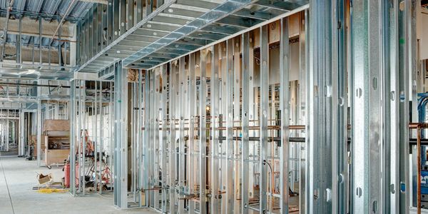 Interior of a building under construction with metal studs.