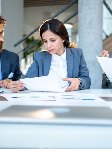 Professional team reviewing documents during a business meeting.