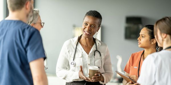 Healthcare professionals discussing in a meeting.