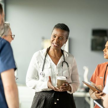 Medical professionals discussing patient care in a hospital setting.