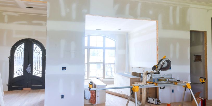 Home addition with front foyer and sunroom