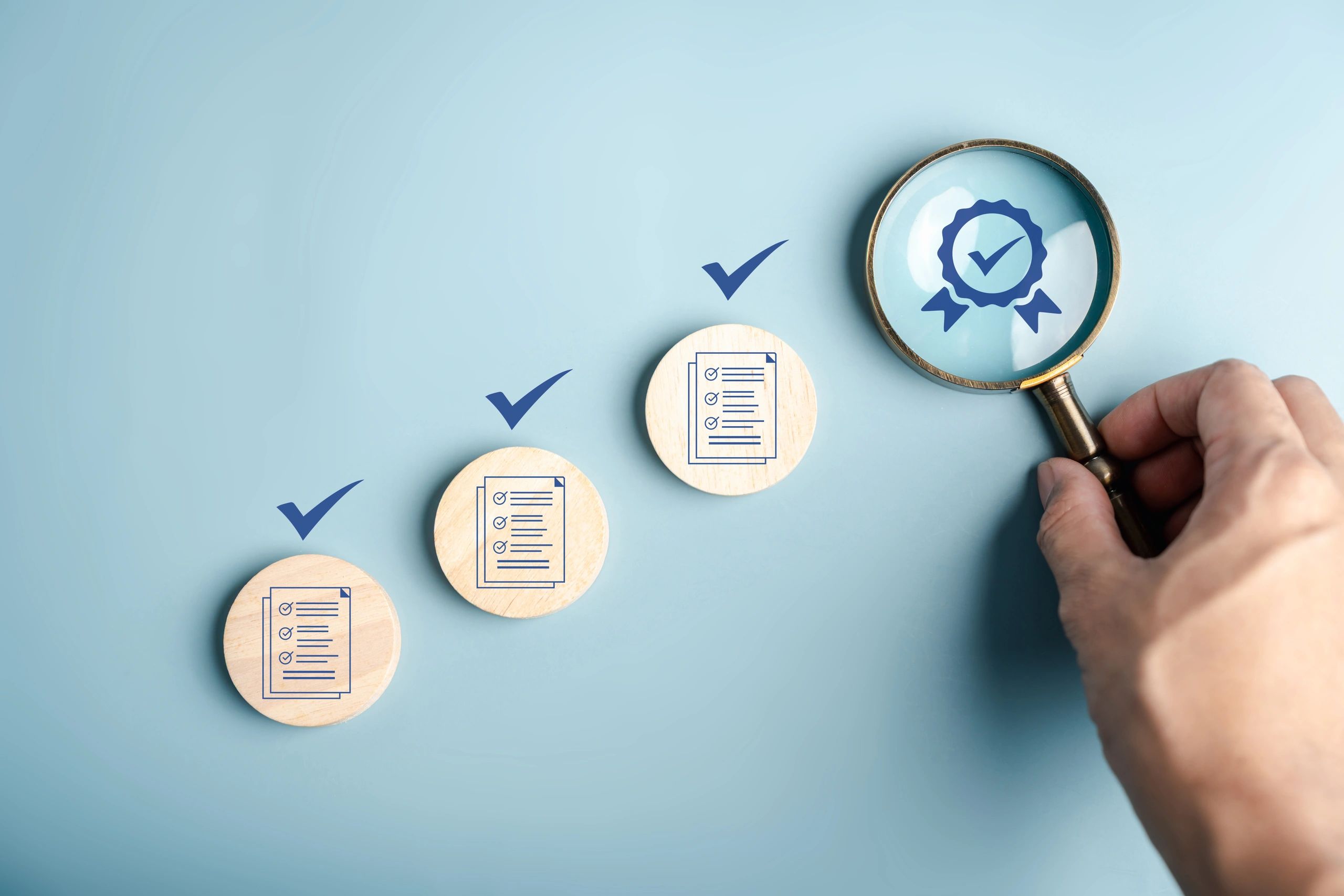 Magnifying glass focusing on a quality badge with checklist icons and checkmarks.