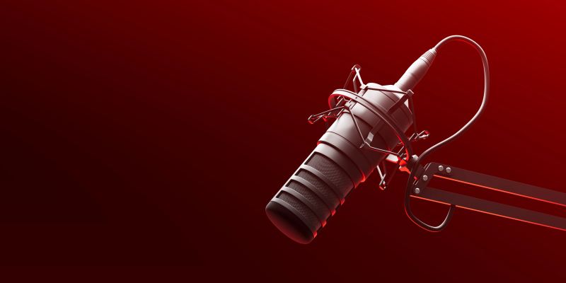 Studio microphone with shock mount and cable in close-up, 3D Rendering style, isolated on red gradient background, concept of podcasting and sound