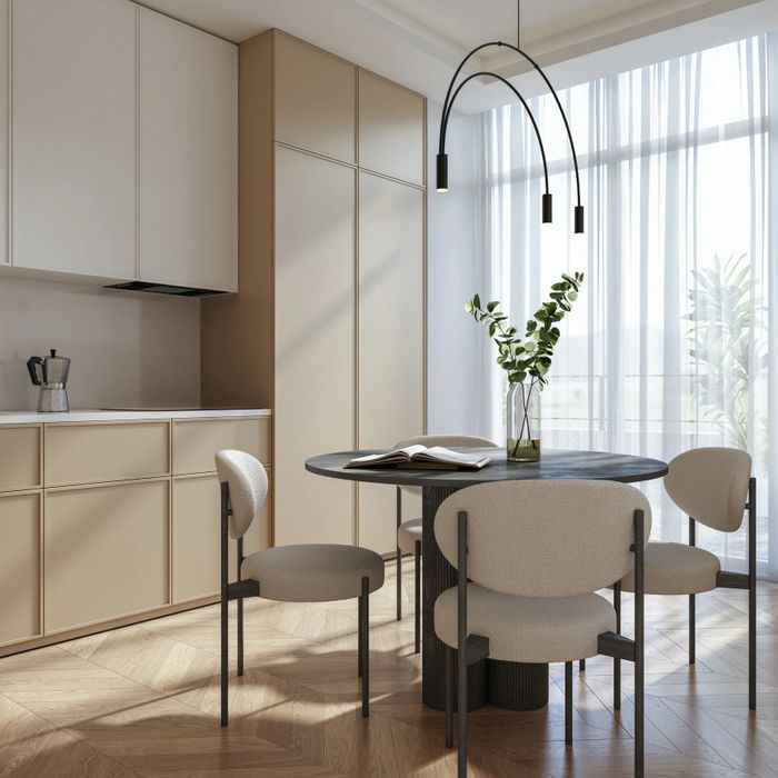 Stack of books next to pencils in a holder and a camera.