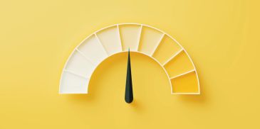 A gauge meter with a needle pointing to the middle.