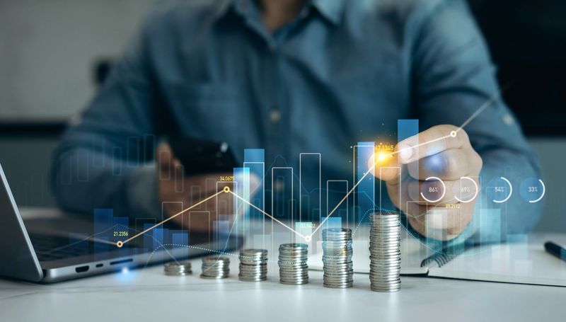 Saving money concept.Stack of coins with trading price graph growth.Money business financial graph diagram of coin. Financial growth data or investment market profit bar and success report