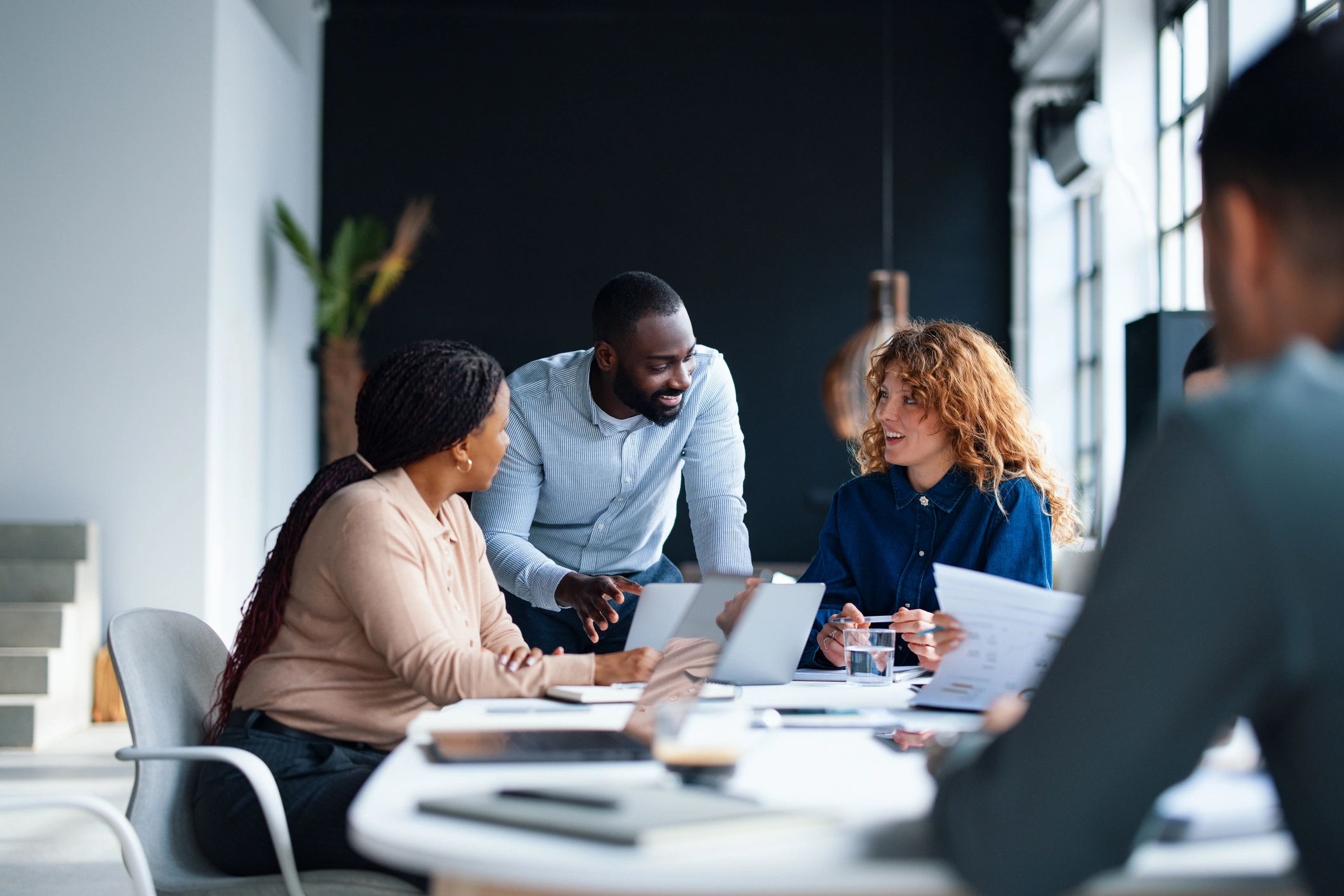 Active listening and lively discussion around a conference table.