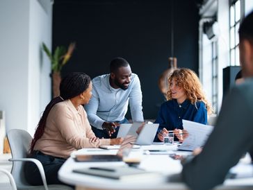 Team collaborating in a modern office.