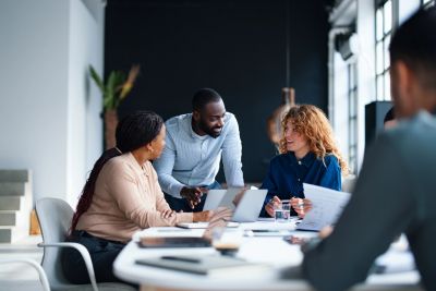 Colleagues collaborating in a bright office.