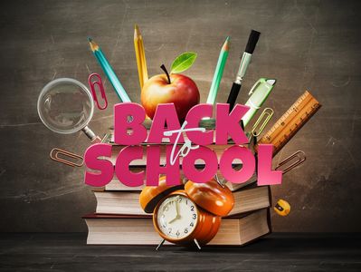 Back to school with supplies and an apple.