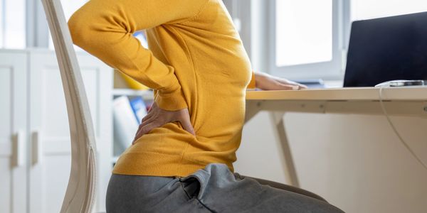 Woman stretching her back before myofascial release at Wholly Spirit Hands Sugar Land.