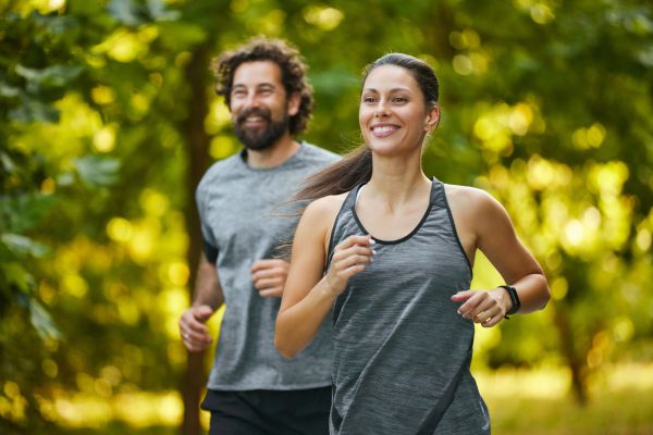 Man and woman jogging outdoors together.