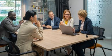 Colleagues having a meeting around a table.