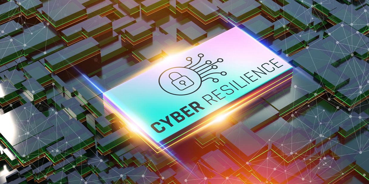 A glowing chip with a lock icon and the words 'Cyber Resilience' on a futuristic circuit board.