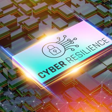 A glowing digital chip displaying 'Cyber Resilience' with a lock symbol.