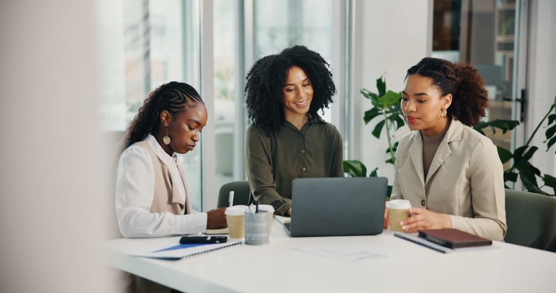 Planning, meeting or business women with laptop for feedback, collaboration or investment. Teamwork, technology or financial advisors talking for project research, budget growth or risk management