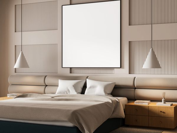 Modern bedroom with beige tones and minimalist design.