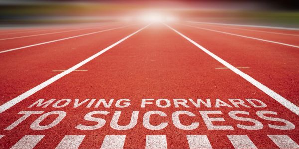 Running track with motivational text about success.