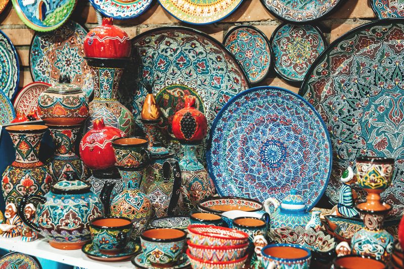 Colorful traditional Uzbek ceramics and souvenirs, with intricate hand-painted patterns and folk art motifs, Samarkand, Uzbekistan. April 25, 2023