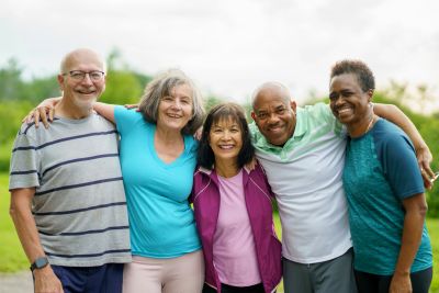 Group of happy diverse seniors outdoors.
