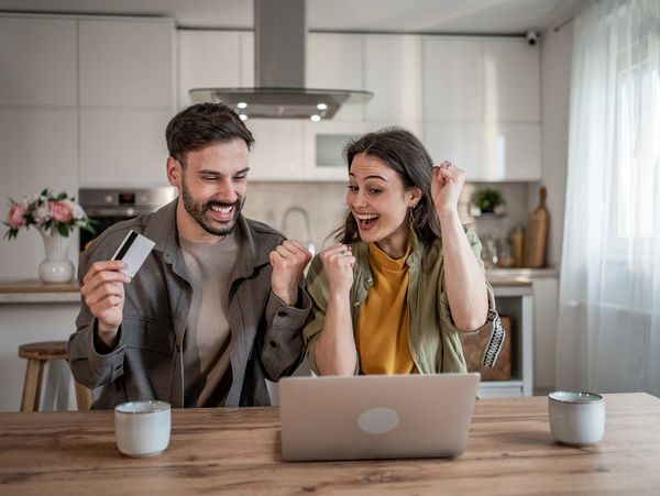 Family happily receiving keys to their new home.