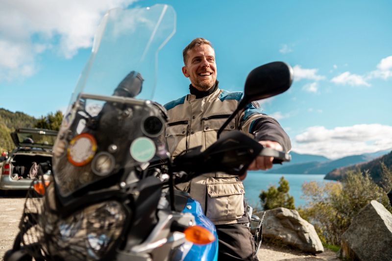 Motorcyclist looking around during a motorcycle ride in Patagonia, Argentina