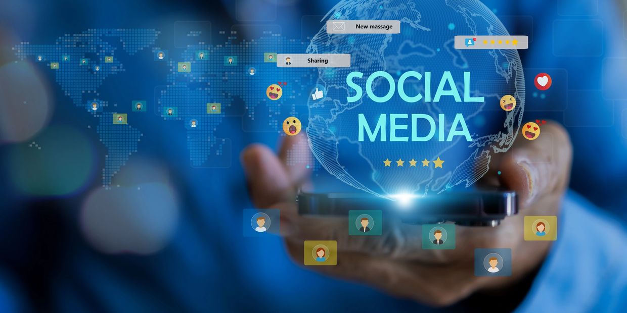Social Media hovers in front of a man holding a digital image of the world.