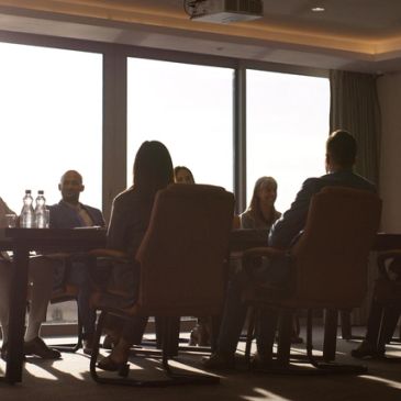 Group of professionals in a meeting room.