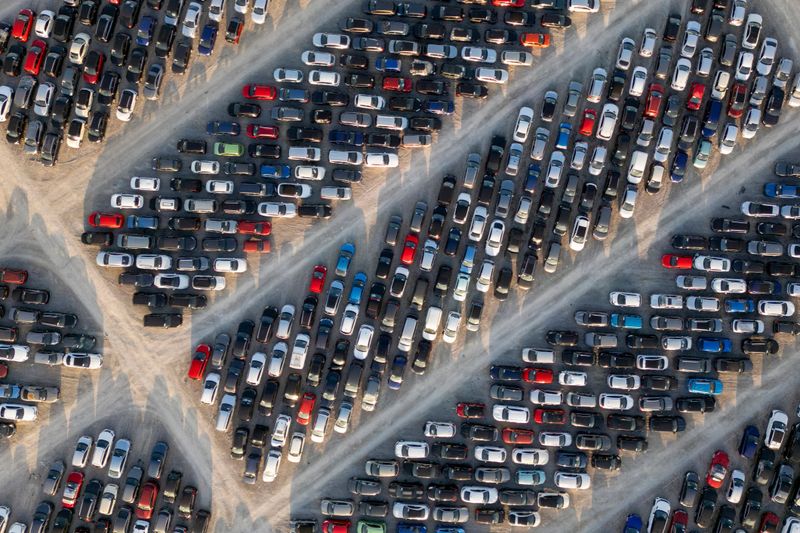 Aerial view of stockpiled used cars.