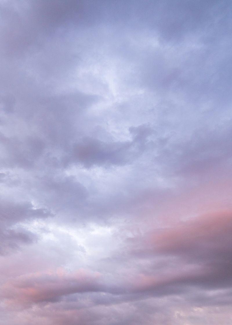 Stunning sunset sky filled with vibrant pink, orange, purple hues. Soft, dramatic clouds create peaceful and dreamy atmosphere. Ideal for backgrounds, nature.