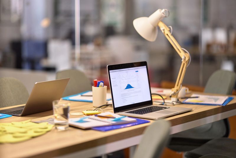 Business diagram on laptop monitor at the table in a modern office.