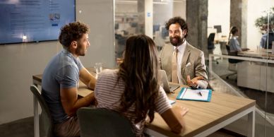Three people having a business meeting.