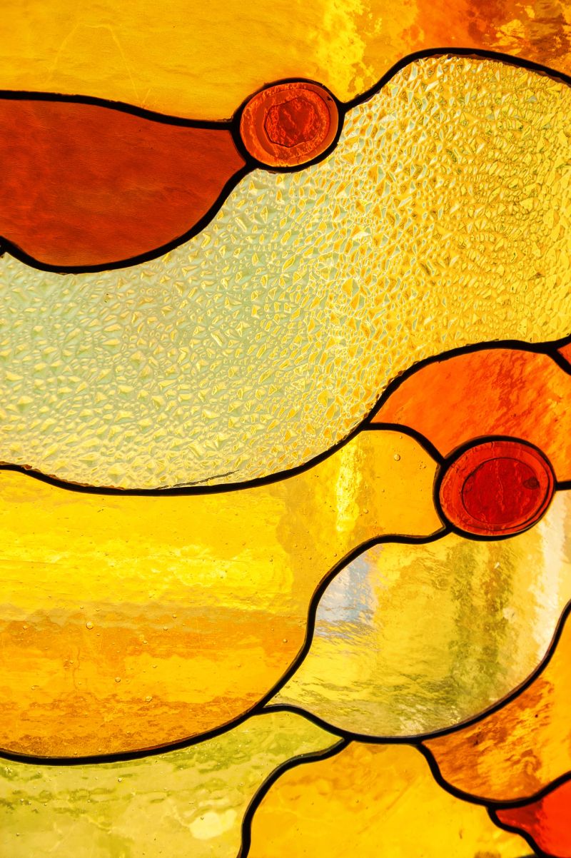 Ornate decorative glasswork with colorful stainedglass art with warm curves