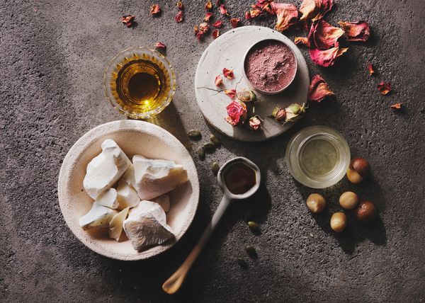 Natural skincare ingredients and powders arranged aesthetically.