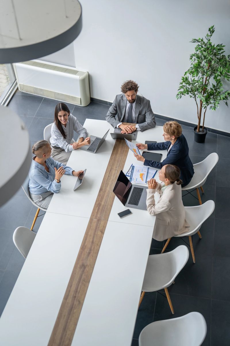 Business colleagues discussing financial results during a productive meeting in a modern office