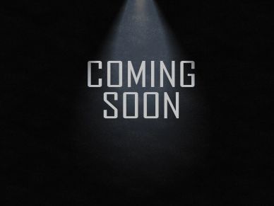 Texto "Coming Soon" iluminado en fondo oscuro.