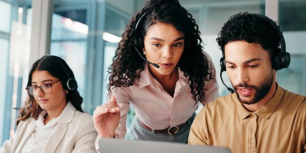 Team of call center agents working together.