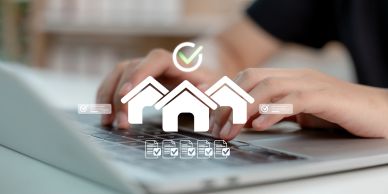 Person typing on a laptop with house icons and checkmarks overlay.