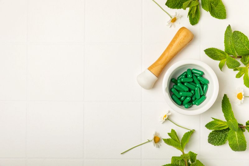 Alternative medicine herbal capsule organic drug on wooden background.Assortment of herbal and tablets,vitamins and dietary supplements.medicinal and Healing herbs.natural supplements for healthy life