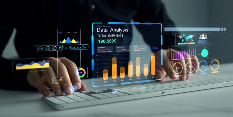 Professional working on virtual dashboard with interactive business data, global charts, financial KPIs, and performance analytics on futuristic digital interface.
