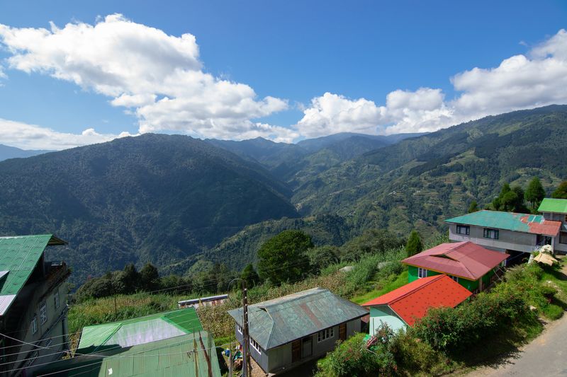 Homestay at Okhrey village, Himalayan mountain range in the background . Okhrey is a remote village with scenic natural vista in Sikkim, India. Many homestays are available for tourists from all over.