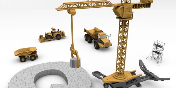 Construction vehicles assembling a puzzle piece shaped like the letter Q.