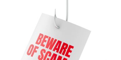 Tag on a fishhook reading 'Beware of scam'.