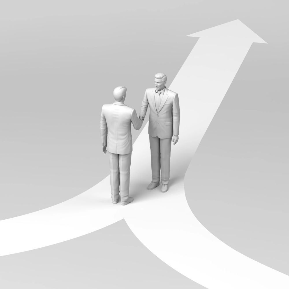 Two businessmen shaking hands on a merging arrow path symbolizing partnership and growth.