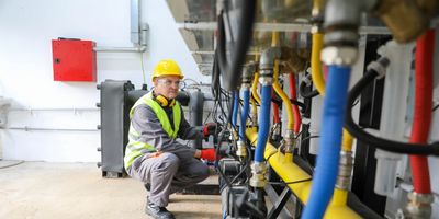 Engineer inspecting industrial machinery.