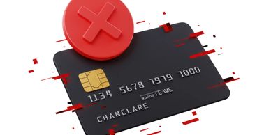 Black credit card with a red cancel symbol indicating a declined transaction.