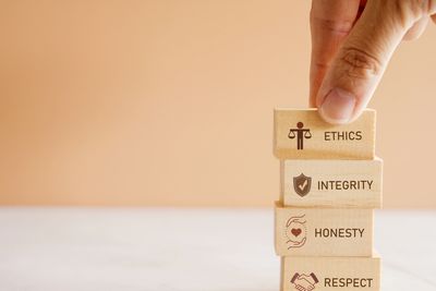 Wooden blocks with ethics, integrity, honesty, and respect concepts.