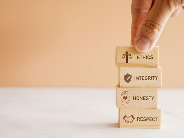 Stacked blocks with ethics, integrity, honesty, and respect on them.