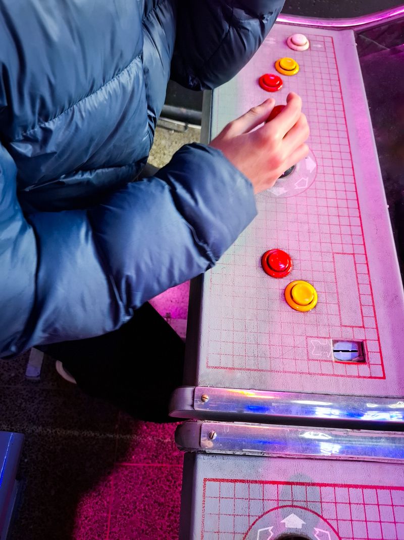 Closeup of teenager playing retro  video game