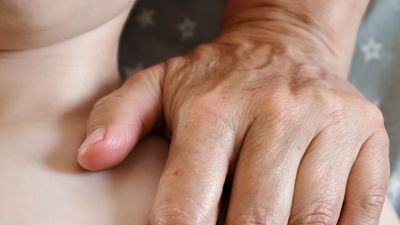 Woman receiving a relaxing chest massage.